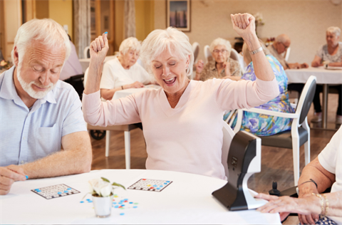 Stock photo of seniors playing bingo at a community center