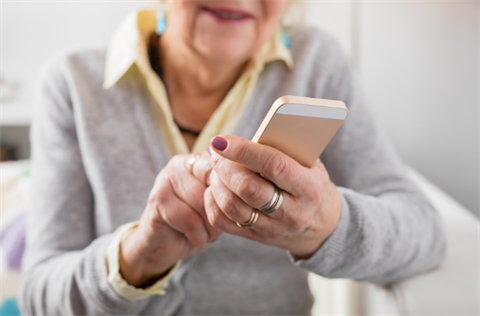 Photo of a senior using a cellphone