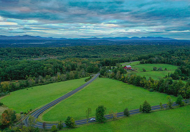 Aerial with Farm and Mountains