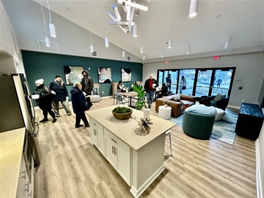 Local officials and partners tour the inside of an apartment at Golden Hill.