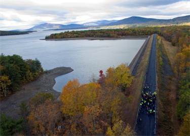 Birdseye view of bikers at the Ashokan Rail Trail along the Ashokan Reservoir