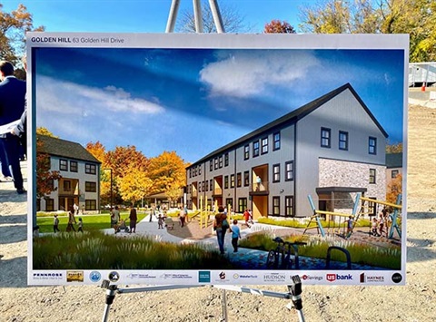 Rendering of Golden Hill Housing Complex on an easel on-site at the property during groundbreaking.