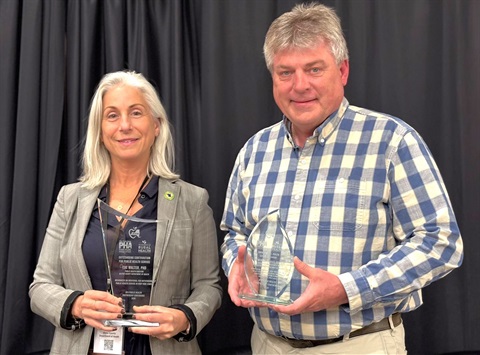Dr. Eve Walter and Time Rose P.E. with their public health awards