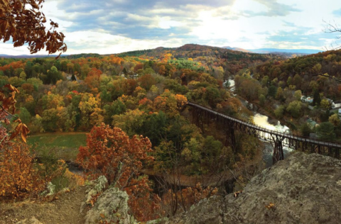 Photo of the Rosendale Trestle in autumn with the leaves changing.